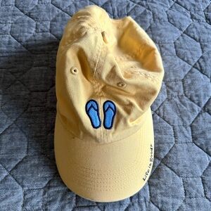 EUC Life Is Good chill cap - yellow with blue flip flops